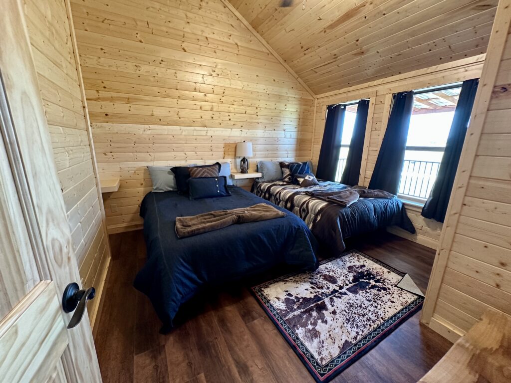 Bedroom 1 at Longhorn Cabin Stay and Play Option at Legends Golf Course near Austin